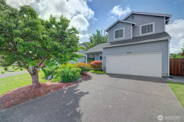 Spacious driveway and attached garage offer ample parking and everyday convenience. Spacious driveway and attached garage offer ample parking and everyday convenience.