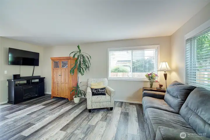 Bright and airy living room filled with abundant natural light. Bright and airy living room filled with abundant natural light.