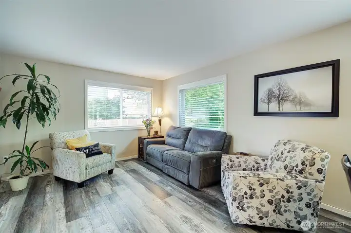 Sun-filled living room showcasing abundant natural light throughout the space. Sun-filled living room showcasing abundant natural light throughout the space.