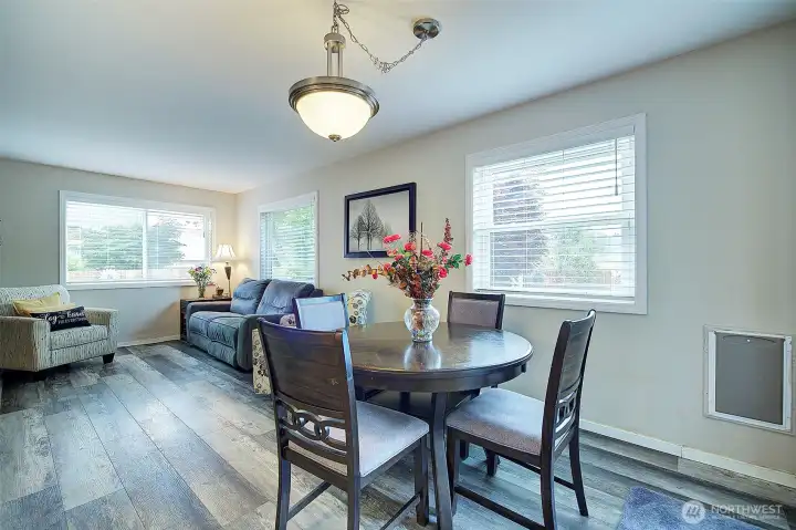 Spacious living room seamlessly connected to the dining area and kitchen, ideal for entertaining. Spacious living room seamlessly connected to the dining area and kitchen, ideal for entertaining.