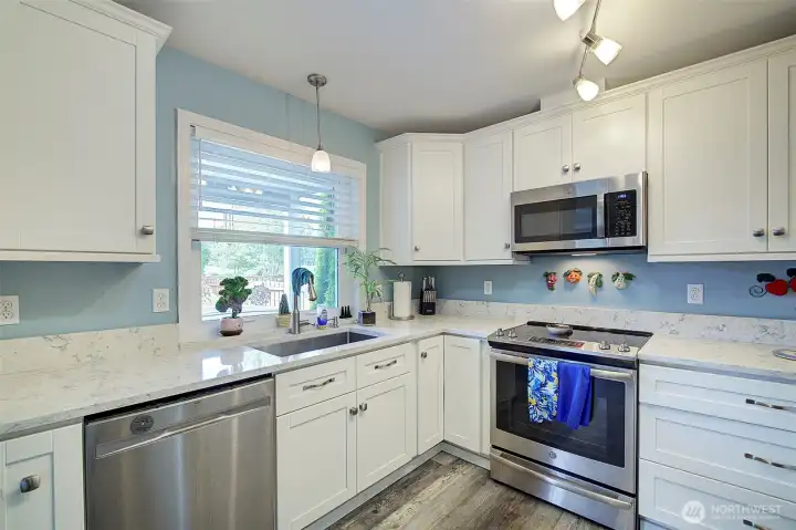 Another view of the updated kitchen highlighting its functional layout and stylish design. Another view of the updated kitchen highlighting its functional layout and stylish design.