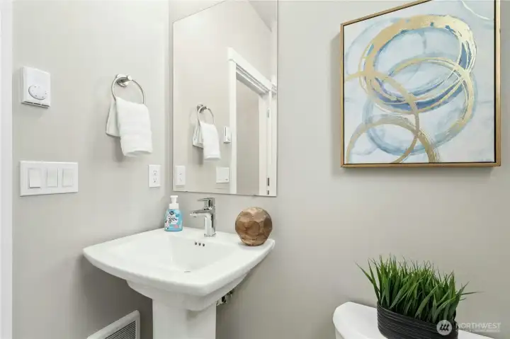 Main-level powder room adds convenience for everyday living and entertaining.