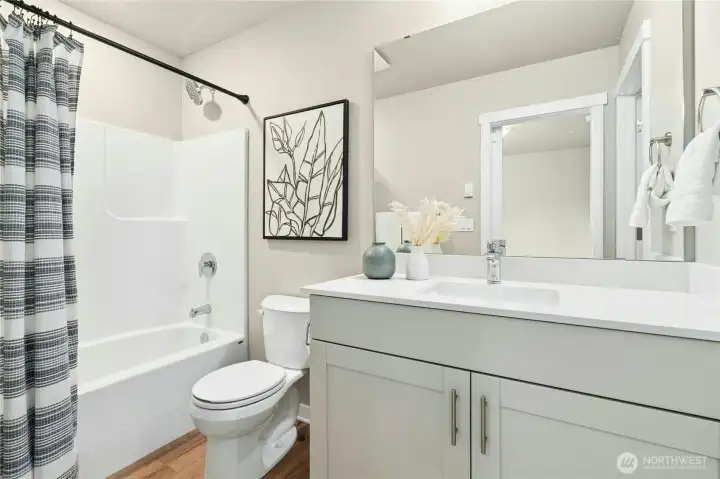Private attached full bath ideal for guests, roommates, or multigenerational living.