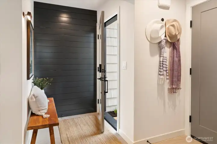 Your entry way features a “design wall” where you can have custom art hanging to greet you. Your entry way features a “design wall” where you can have custom art hanging to greet you.