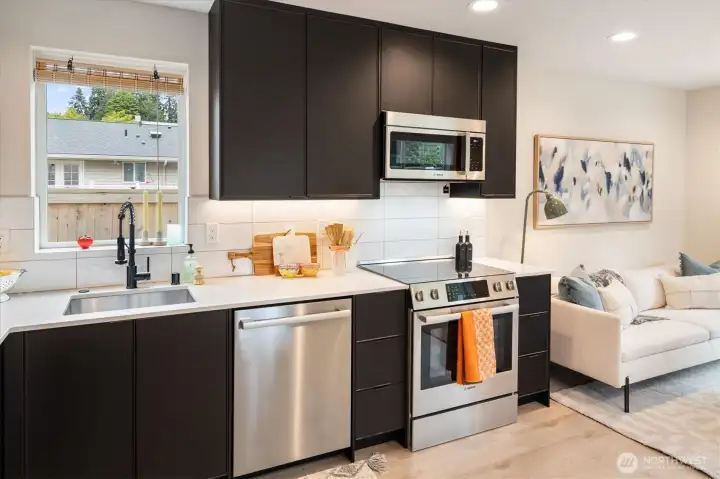 Having a sweet view out the window above the kitchen sink makes it perfect for the busy cook. Having a sweet view out the window above the kitchen sink makes it perfect for the busy cook.