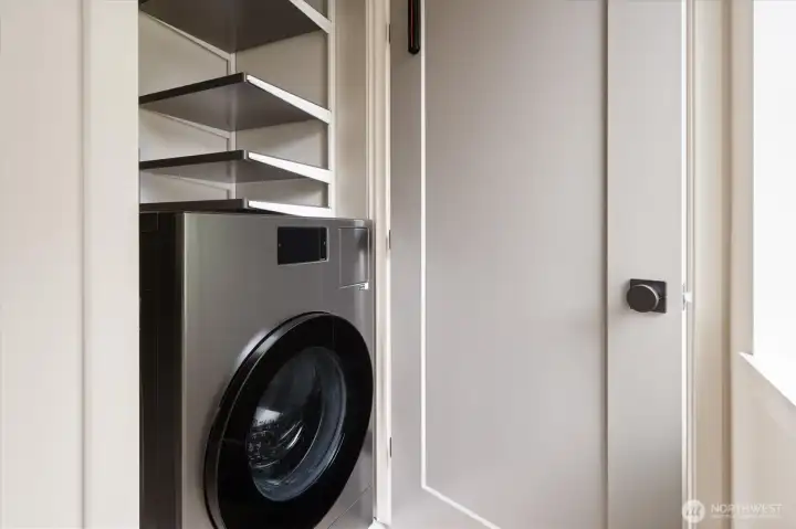 The newer dual use washer/dryer is located on the second floor with convenient shelving above. The newer dual use washer/dryer is located on the second floor with convenient shelving above.