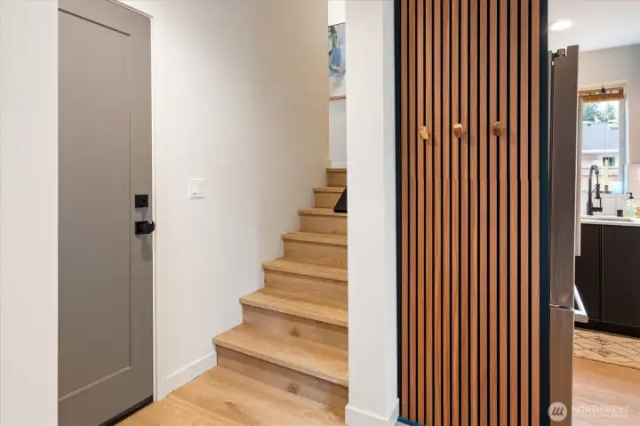 Back inside, there is a door by the entry that opens to a flex room. Back inside, there is a door by the entry that opens to a flex room.