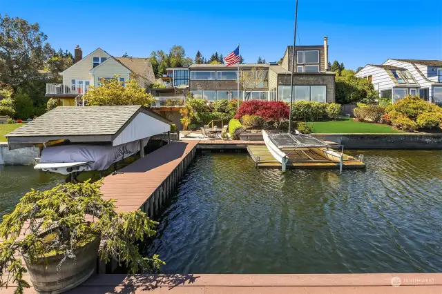PRIVATE dock with deep water moorage, grandfathered covered boathouse, sailboat lift, shore boat lift and an impressive 78 feet of Lake Washington shoreline, this one-of-a-kind retreat offers unparalleled tranquility and a super fun life. You will love the ultimate privacy and convenience with direct access to the Burke Gilman Trail and a deeded membership to the Sheridan Beach Community Club.