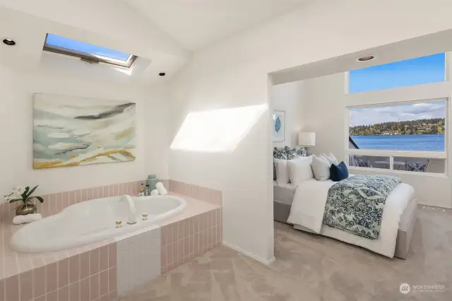 The jetted tub in the primary bathroom is the perfect place to soak away the day.