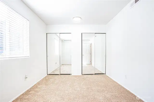 Double closet in bedroom.