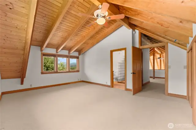 Primary bedroom upstairs w/ on-suite bathroom.