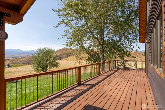 Wrap around deck to sit and enjoy the expansive views.