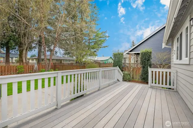 Nice size deck overlooking big patio and fenced yard