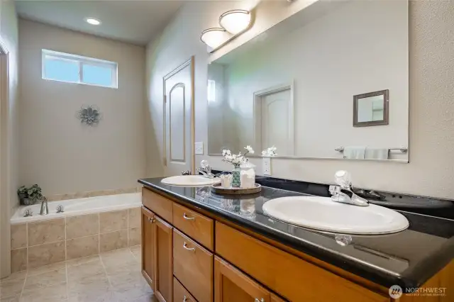 Primary bedroom with double sinks, soaker tub & shower