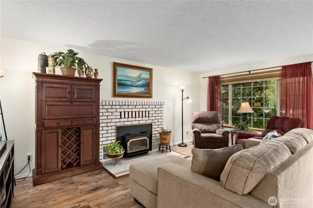 Large living room window brings in lots of natural light.