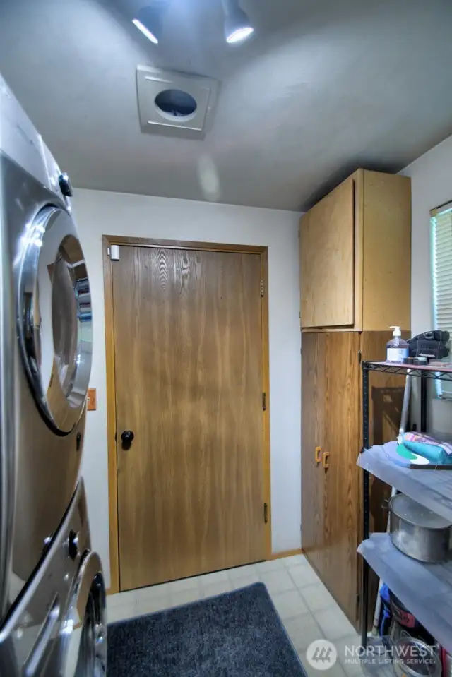 Utility room leading to attached garage
