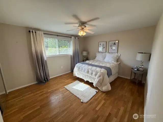 Spacious master bathroom- real hardwood floors