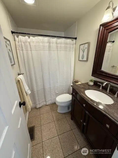 Main bathroom has tiled floors