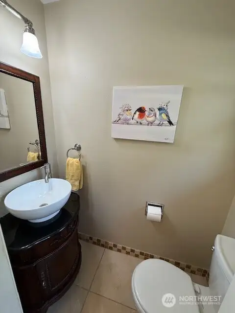 1/2 bathroom located off the mudroom