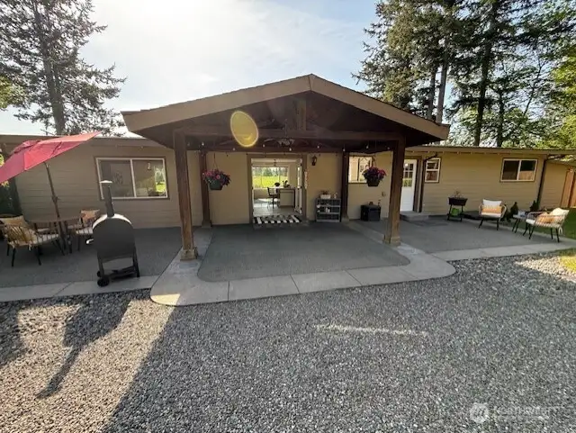 Covered back patio perfect for BBQ, relaxing and having friends & family over!