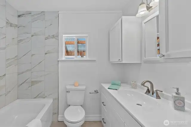 Ta-DAH - brand new tub w/tile shower surround.