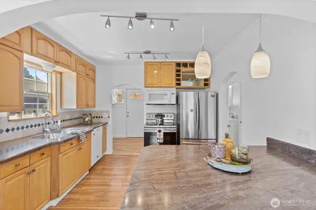 Laminate flooring, tile backsplash, and granite countertops.