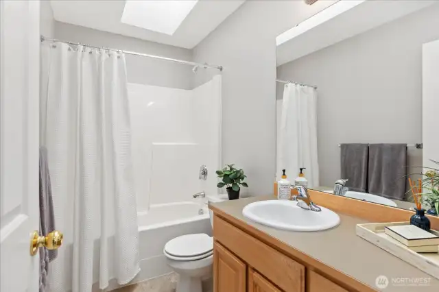 Hall Bath - skylight and easy care acrylic tub surround.