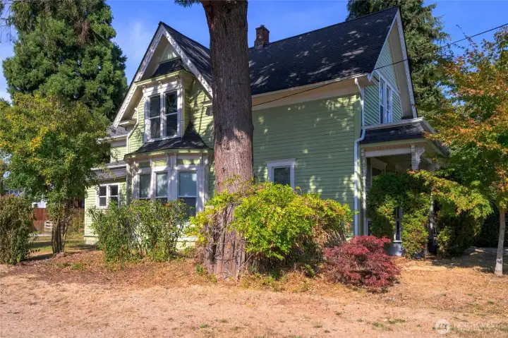 Ideally situated on a large corner lot with mature landscaping.