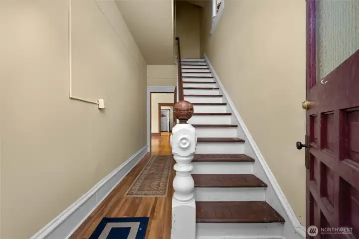 Entry way leads to lower unit (left) and upstairs to upper unit.