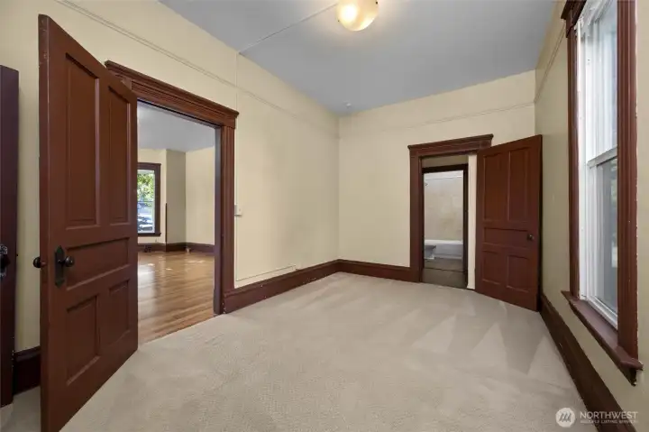 Secondary bedroom has a door leading to living room and to bathroom.