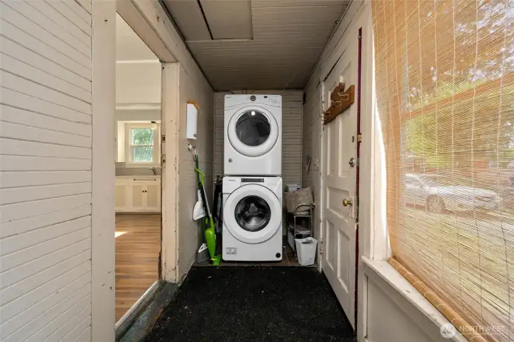 Stackable washer and dryer is shared between upper/lower unit. Located on back porch.