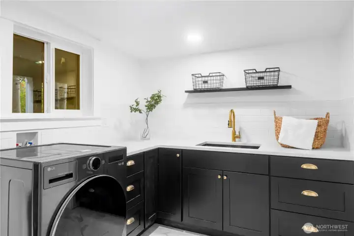 Laundry room with plenty of space including a walk in (not shown)