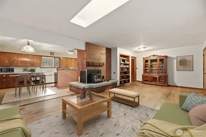 Large living room with wood burning fireplace to sit next too during the cool months and a beautiful focal point in the room.