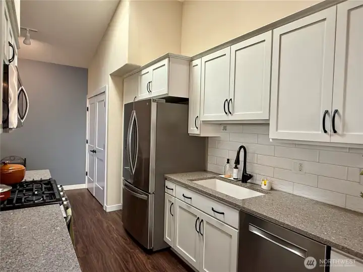 The newly updated kitchen features stainless steel appliances and soft close cabinetry.