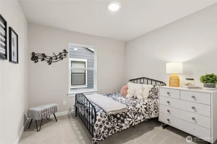 One of the secondary bedrooms. Materials, colors, and finishes will vary. See site agent for details