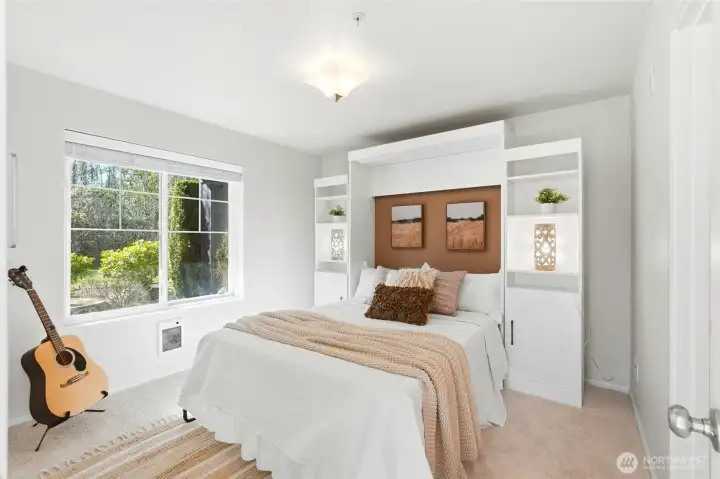 Second primary suite on the entry level with a Murphy bed.