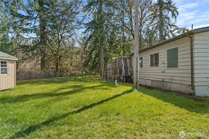 fenced in yard with shed