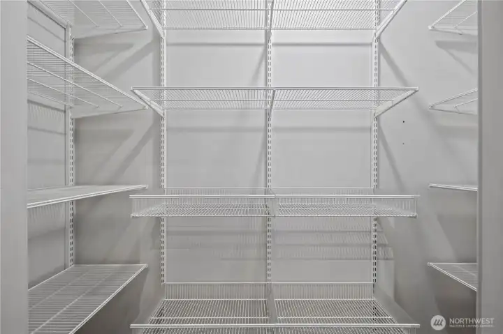 Spacious walk-in pantry offers abundant storage and effortless organization.