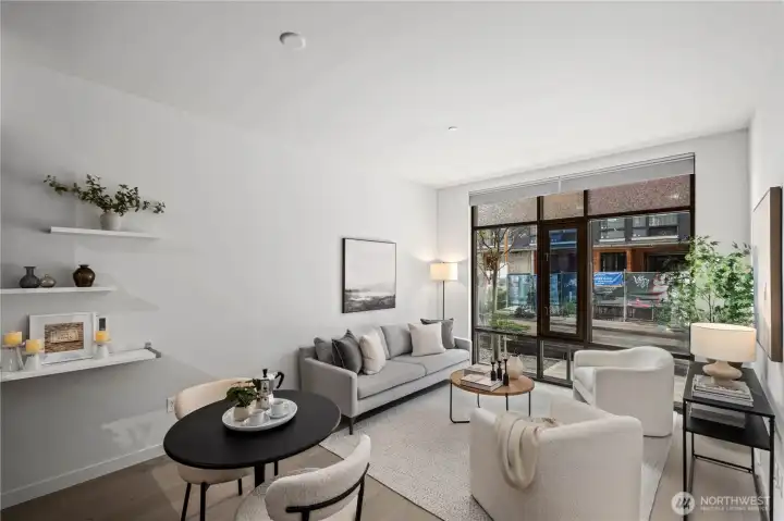 Soaring 10-foot ceilings and dramatic floor-to-ceiling windows flood the home with natural light while automated dual-direction blinds offer effortless privacy and comfort. The west-facing exposure creates a bright, inviting atmosphere throughout the day and warm evening light to enjoy at home.