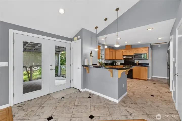 French doors greet you off the covered side porch where you enter to the kitchen and great room French doors greet you off the covered side porch where you enter to the kitchen and great room