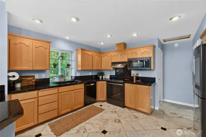 Quartz countertops accent the room and the upgraded sink & motion faucet are handy tools for cooking & baking Quartz countertops accent the room and the upgraded sink & motion faucet are handy tools for cooking & baking