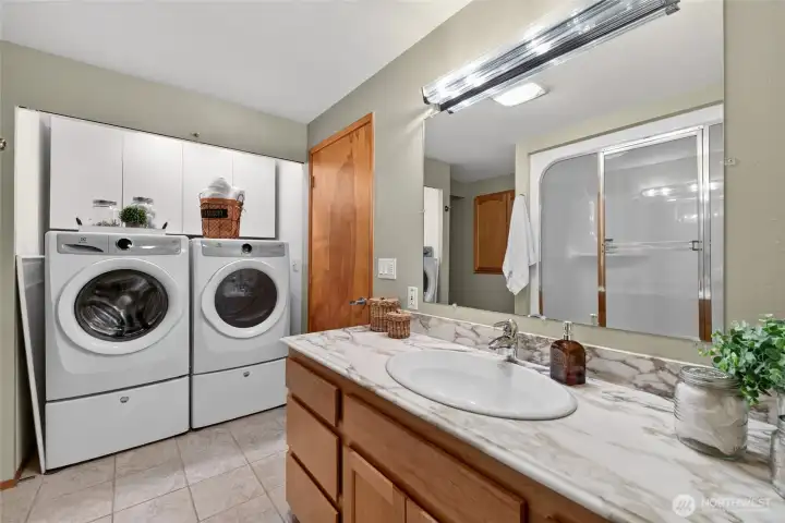 The laundry space has added shelving and the front load washer & dryer with pedestals are included The laundry space has added shelving and the front load washer & dryer with pedestals are included