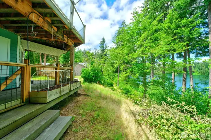 There are 2 decks on the lower level plus garden boxes for your flowers or veggies. The yard is a blank canvas for creating your dream landscape There are 2 decks on the lower level plus garden boxes for your flowers or veggies. The yard is a blank canvas for creating your dream landscape