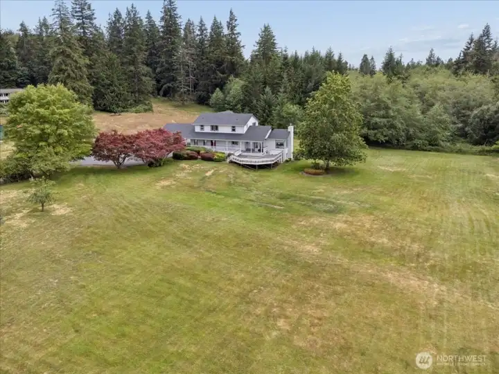 Stunning home on lush grounds surrounded by farms and rolling hills. Feels like you are away in the country but you are really only a few minutes to town!