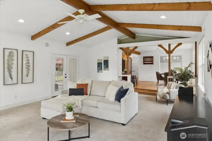Incredibly huge family or living room with high ceilings and propane fireplace.