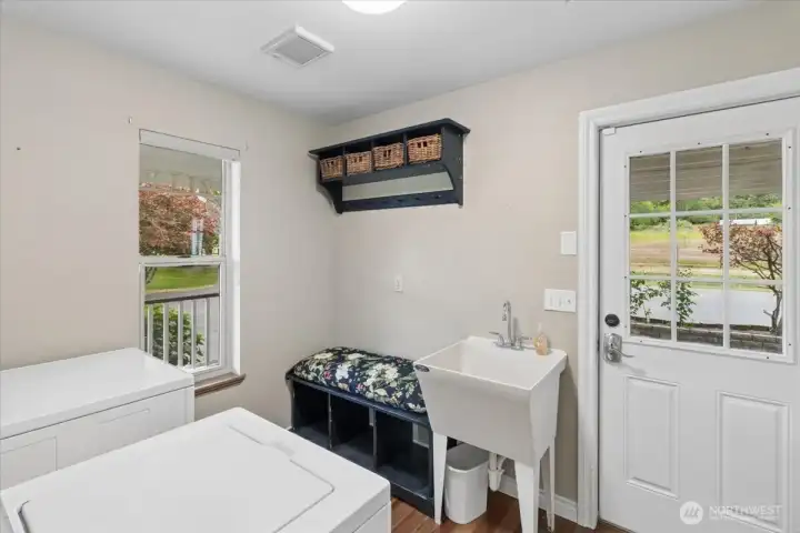 Main level mud room/laundry. Great storage closet and deep sink in this space.