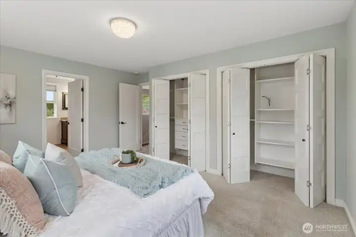 Primary bedroom with custom closet organizers and ensuite bath.