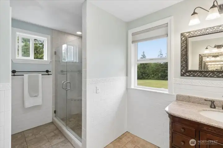 Primary Bathroom, walk in shower, and 2 separated sink areas.