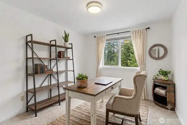 One of the 3 rooms on upper level, this one is a great office space! Digitally staged.