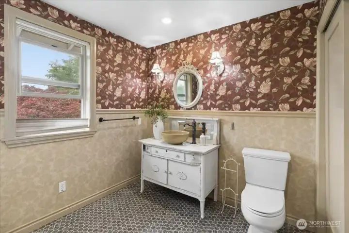 Full bath upstairs, features tub and storage closet.